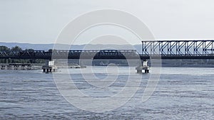 Train passing over bridge at Danube river