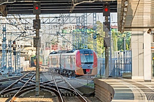 Train passing a railroad crossing. Dutch signs warning not go and red lights flashing