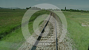 A train passing through some woods.