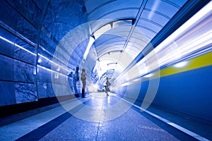 Train on platform in subway