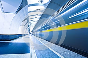 Train on platform in subway