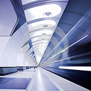 Train on platform in subway