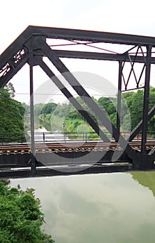 Train pratt truss steel bridge over Pasak river Thailand