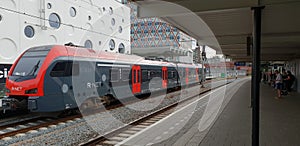 Train of R-Net waiting on the station of Gouda to depart to Alphen aan den Rijn with cinama with cheese holes on the back