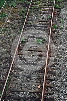 Train railroad tracks in the street in the station