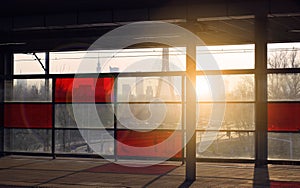 Train on the railroad tracks during sunset. Perron at the train station.