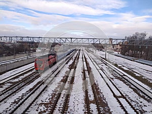 Train on railroad tracks in winter