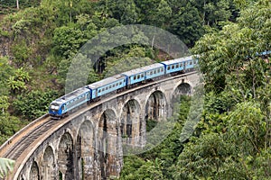 Train on Nine Arches bridge in hill country of Sri Lanka