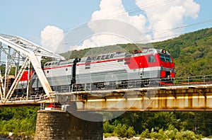 Train rides over bridge