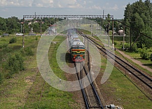 Train rides on rails at the station. Aerial view
