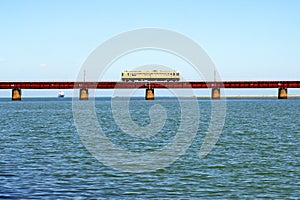Train running on Yura Bridge over Yura River photo