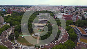 Train runs over bridge city Berlin. Spectacular aerial view flight drone