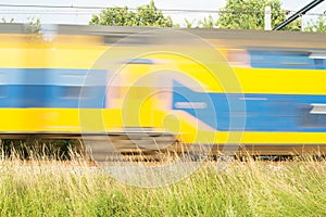 Train rushes by at high speed, Netherlands