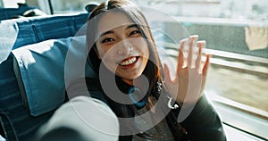 Train, selfie and portrait of woman wave in city for travel, commute and journey on metro transportation in town