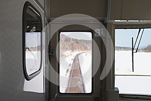 The train slows down in order to get into the snow-covered curves.