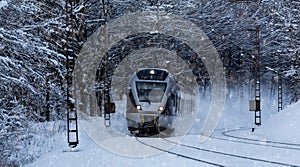 Train speeding in a snowy winter night