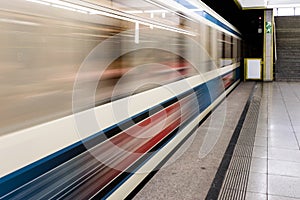 Train speeding through a station