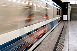 Train speeding through a station