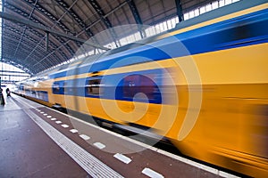 Train speeding up in Amsterdam Central Station