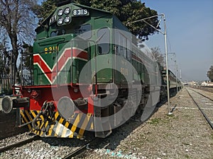 Train standing at Railway platform, front side of a train, low angle click, public transportation, old fashioned train