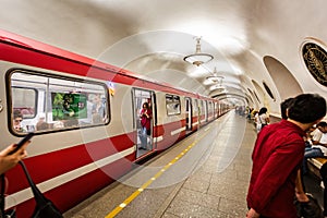 Train standing at station platform with doors open in St Petersburg Metro in St Petersburg, Russia