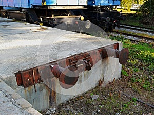 A train station buffer stop protects apron from a damage close up