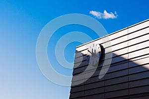 Train station Clock on building wall Hakodate Station against blue sky