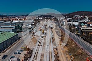 Train station of Grosuplje in Slovenia is being renovated. Visible new track layout and work trains on the tracks on a sunny day