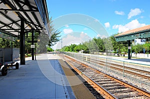 Train station, luggage cart, tracks in South Florida