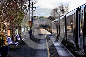 Train station with metal benches in Windermere, Lake District, England, United Kingdom