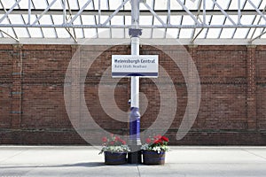 Train station sign brick wall railway central London photo