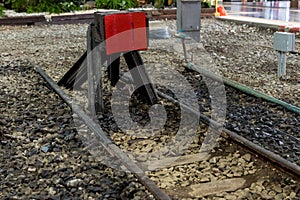 Train stopper or Train bumper installed on track for break. Train stopper for stop train running while parking at railway station photo