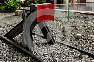 Train stopper or Train bumper installed on track for break. Train stopper for stop train running while parking at railway station photo