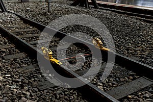 Train stopper or Train bumper installed on track for break. Train stopper for stop train running while parking at railway station photo