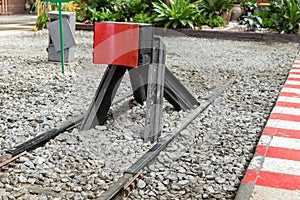 Train stopper or Train bumper installed on track for break. Train stopper for stop train running while parking at railway station photo