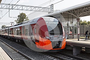 Train Swallow arrives at the passenger platform station Botanical Garden of the Moscow central ring