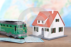 The train ticket home and the little green train and the little house