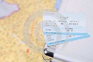 Train ticket on a suitcase
