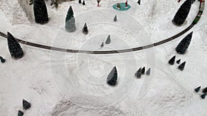 Train toys steam locomotive at landscape winter snow cover.