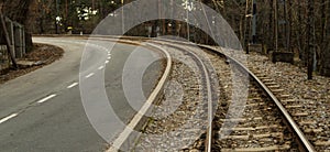 Train track next to the road at the old Camorritos station in Cercedilla, community of Madrid, Spain photo