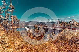 Train tracks on a bridge over the river