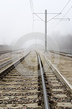 Train Tracks Disappear Into Fog