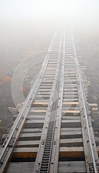 Train Tracks heading into fog