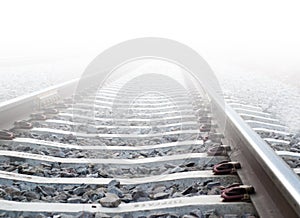 Train tracks in heavy fog