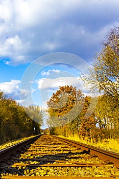 Train tracks through nature to infinity in Germany