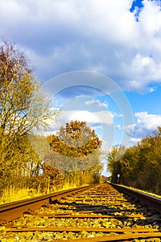 Train tracks through nature to infinity in Germany