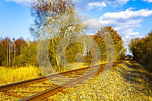 Train tracks through nature to infinity in Germany