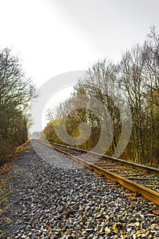 Train tracks through nature to infinity in Germany