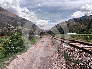 Train tracks near highway photo