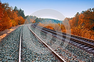 Train tracks view with autumn forest